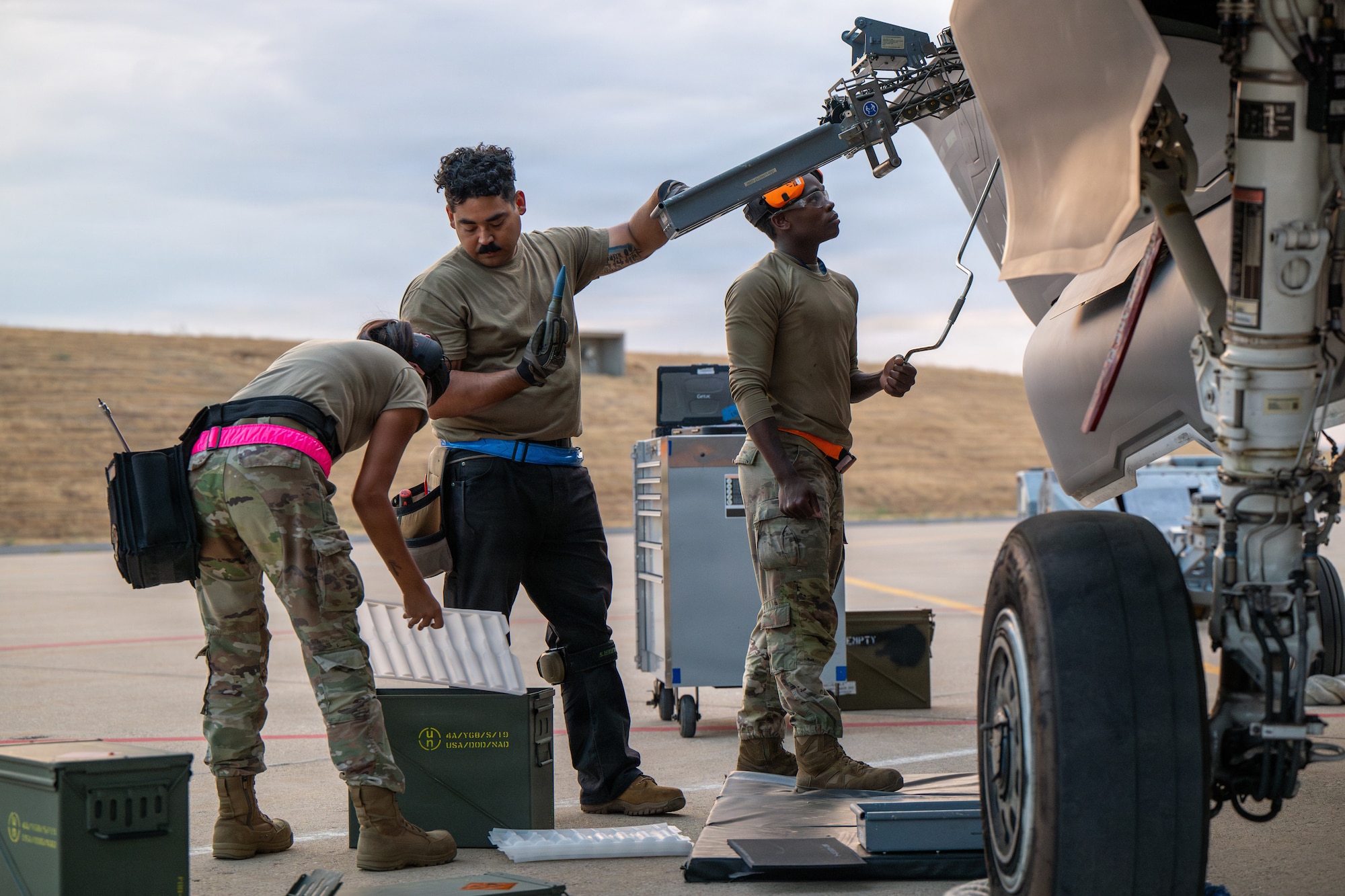 U.S. Air Force Airman 1st Class Sophia Nieto, 325th Aircraft Maintenance Squadron weapons load crew member, Staff Sgt. Mario Romero-Sherman, 325th AMXS weapons load crew chief, and Airman 1st Class Caiden White, 325th AMXS weapons load crew member, download unexpended ammunition during Weapons System Evaluation Program-Combat Hammer 26.07 at Hill Air Force Base, Utah, Aug. 12, 2026.