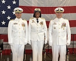 Three members pose for picture.