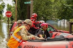 Indiana National Guardsmen with the 113th Engineer Battalion assist the Indianapolis Fire Department with flood evacuations Aug. 15, 2026, in response to devastating storms that swept through Indiana. Photo by Staff Sgt. Christopher Estrada.