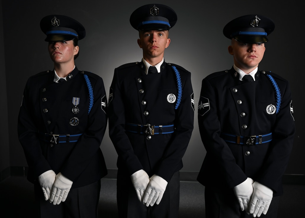 From left, U.S. Space Force Spc. 3 Amelia Olsen, Spc. 3 Dylan Lee, and Spc. 3 Logan Bergstrom, ceremonial guardsmen with the U. S. Space Force Honor Guard, model the new Honor Guard ceremonial uniforms at Joint Base Anacostia-Bolling, Washington, D.C., Aug. 21, 2026. The new uniform was designed to replace the modified U.S. Air Force service uniform Guardians wore when the branch was first established in 2019. (U.S. Air Force photo by Senior Airman Shanel Toussaint)