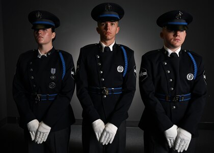 From left, U.S. Space Force Spc. 3 Amelia Olsen, Spc. 3 Dylan Lee, and Spc. 3 Logan Bergstrom, ceremonial guardsmen with the U. S. Space Force Honor Guard, model the new Honor Guard ceremonial uniforms at Joint Base Anacostia-Bolling, Washington, D.C., Aug. 21, 2026. The new uniform was designed to replace the modified U.S. Air Force service uniform Guardians wore when the branch was first established in 2019. (U.S. Air Force photo by Senior Airman Shanel Toussaint)