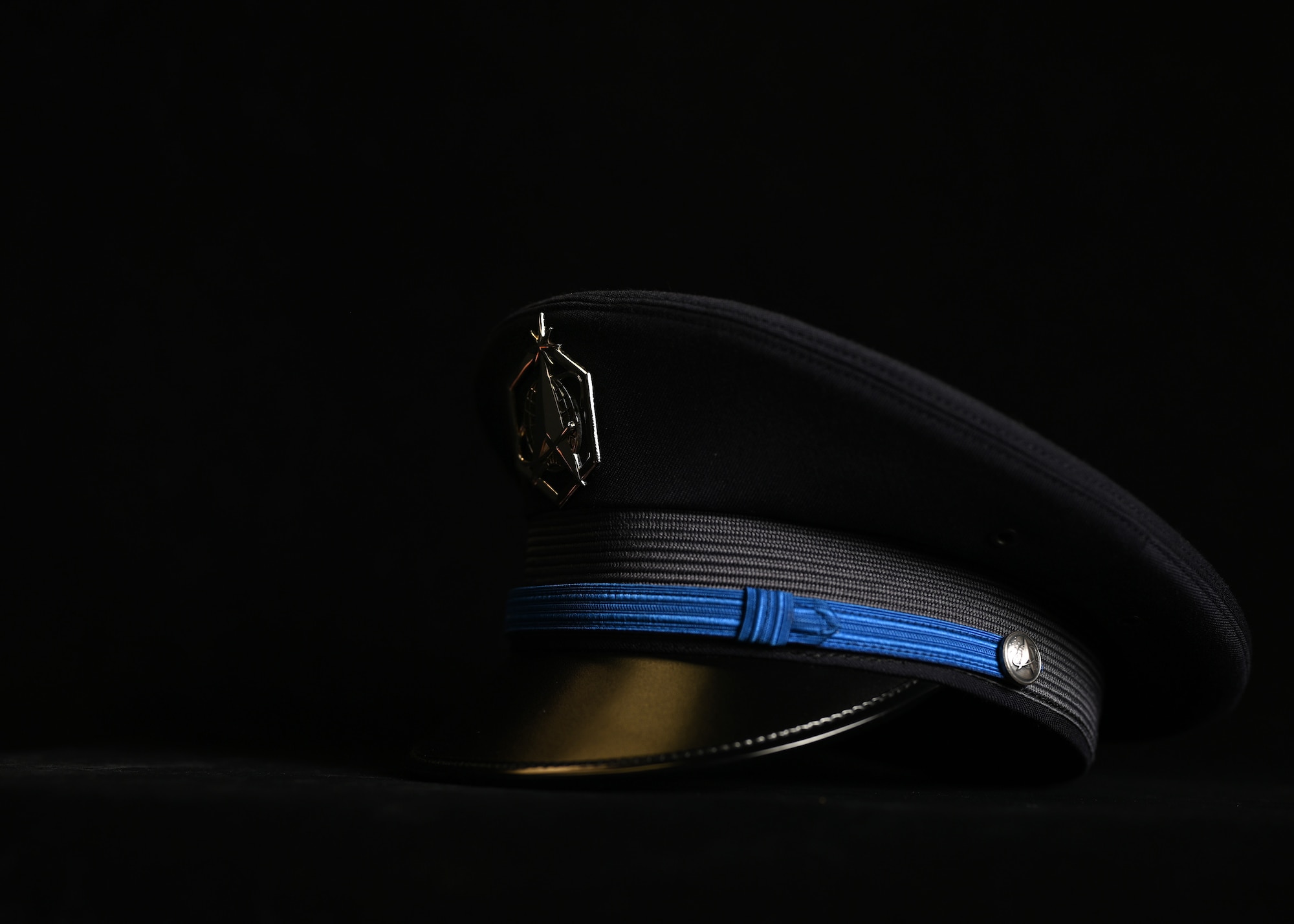 The updated U.S. Space Force Honor Guard ceremonial cap lays on a table at Joint Base Anacostia-Bolling, Washington, D.C., Aug. 21, 2026. The guidance for the new U.S. Space Force uniform was released Jan. 13, 2026, with the Honor Guard ceremonial guardsman uniform debuting seven months later. The new uniform was designed to replace the modified U.S. Air Force service uniform Guardians wore when the branch was first established in 2019. (U.S. Air Force photo by Senior Airman Shanel Toussaint)