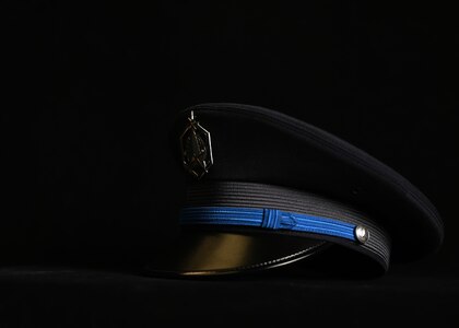 The updated U.S. Space Force Honor Guard ceremonial cap lays on a table at Joint Base Anacostia-Bolling, Washington, D.C., Aug. 21, 2026. The guidance for the new U.S. Space Force uniform was released Jan. 13, 2026, with the Honor Guard ceremonial guardsman uniform debuting seven months later. The new uniform was designed to replace the modified U.S. Air Force service uniform Guardians wore when the branch was first established in 2019. (U.S. Air Force photo by Senior Airman Shanel Toussaint)
