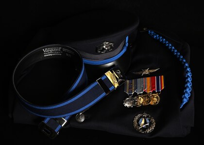 Articles of the new U.S. Space Force Honor Guard ceremonial uniform are displayed at Joint Base Anacostia-Bolling, Washington, D.C., Aug. 21, 2026. The updated uniform features a distinct Space Force blue belt, cap, and rope over the left shoulder. (U.S. Air Force photo by Senior Airman Shanel Toussaint)