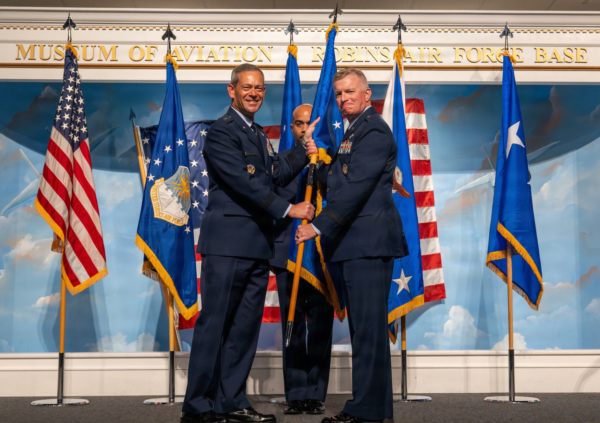 Air Force Chief of Staff Gen. Ken Wilsbach hands the guidon to Lt. Gen. Paul Fast