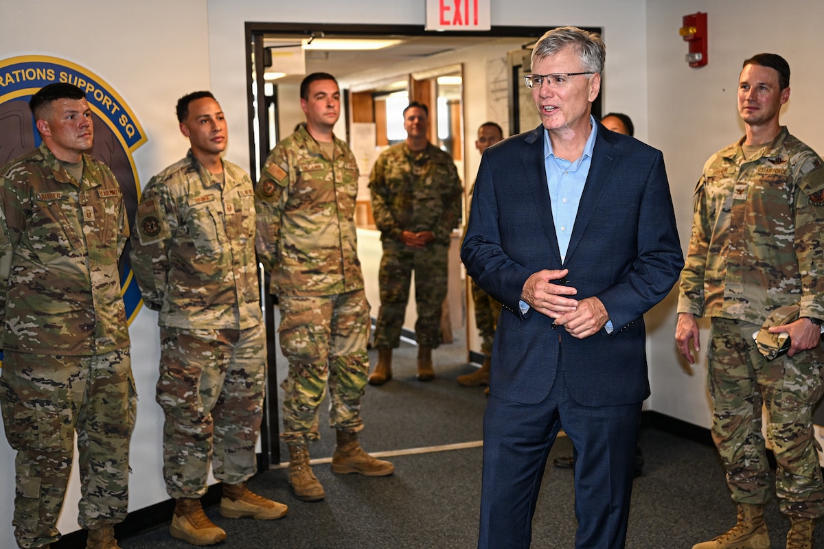 Secretary of the Air Force Troy E. Meink addresses a group of Airmen at McConnell Air Force Base, Kansas, Aug. 12, 2026. Secretary Meink handed out several challenge coins before delivering final thoughts prior to his departure from the base. (U.S. Air Force photo by Senior Airman Amelio Brown)