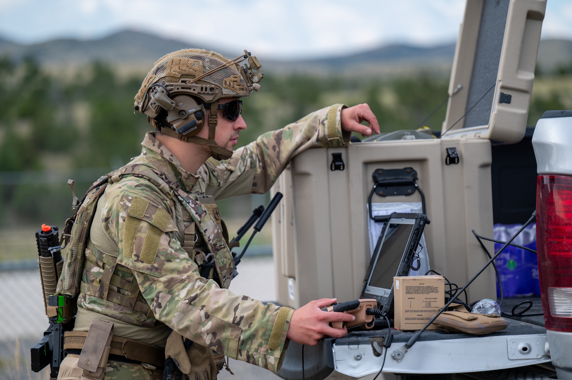 U.S. Air Force Senior Airman Mitchell Massa, 366th Civil Engineer Squadron explosive ordnance disposal (EOD) technician, operates the control system for the Man Transportable Robotic System Increment II during an exercise at Limestone Hills Training Area, Montana, Aug. 18, 2026. The Man Transportable Robotic System allows EOD teams to investigate and handle suspected devices remotely, keeping technicians outside the blast radius. (U.S. Air Force photo by Tech. Sgt. Aaron Thomasson)