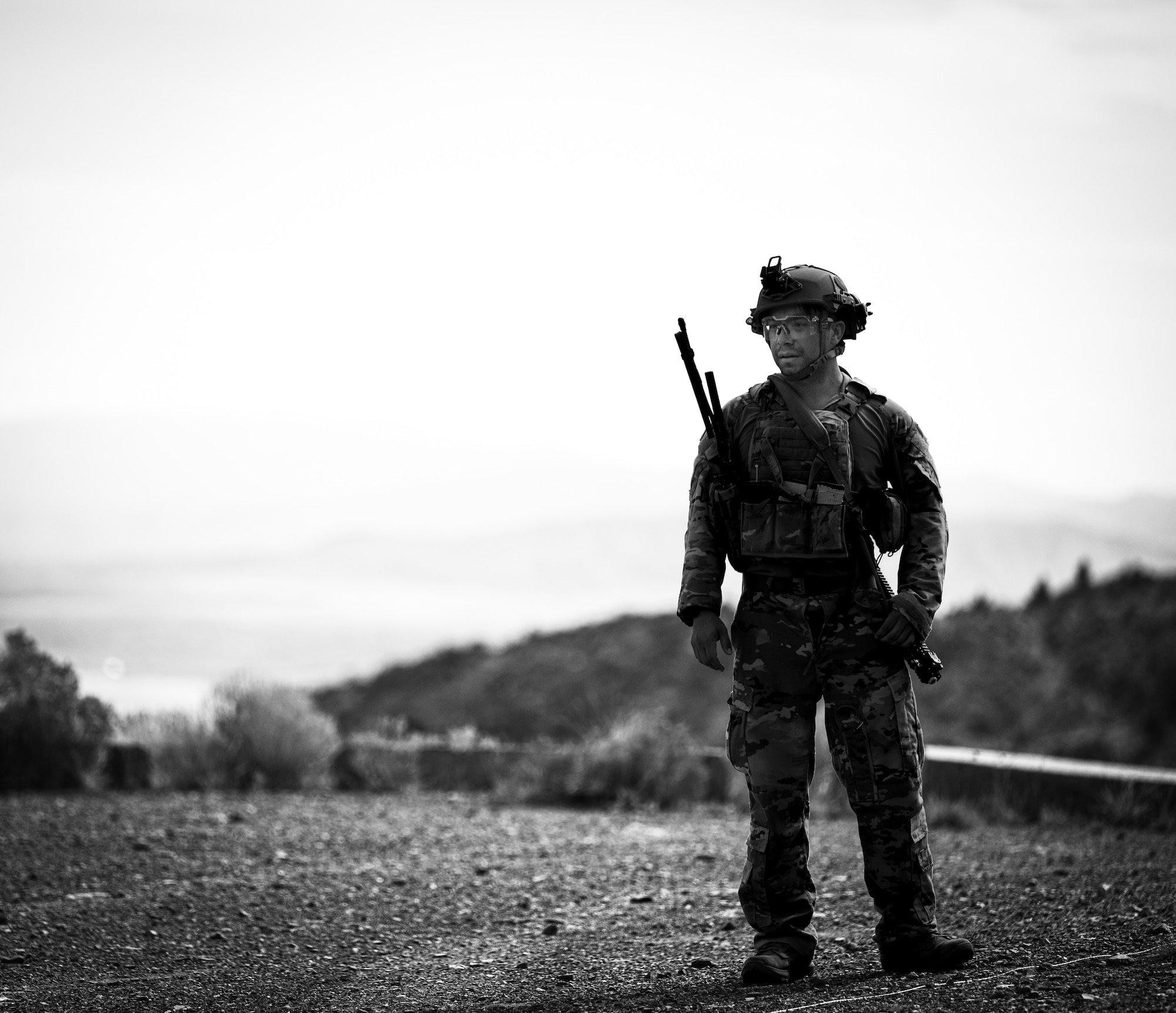U.S. Air Force Senior Airman Miguel Loza, 366th Civil Engineer Squadron explosive ordnance disposal (EOD) technician, prepares to render safe a simulated explosive device during an exercise at Limestone Hills Training Area, Montana, Aug. 18, 2026. EOD Airmen train to stay ready for the full range of explosive threats, from conventional munitions to improvised and chemical hazards. (U.S. Air Force photo illustration by Tech. Sgt. Aaron Thomasson)