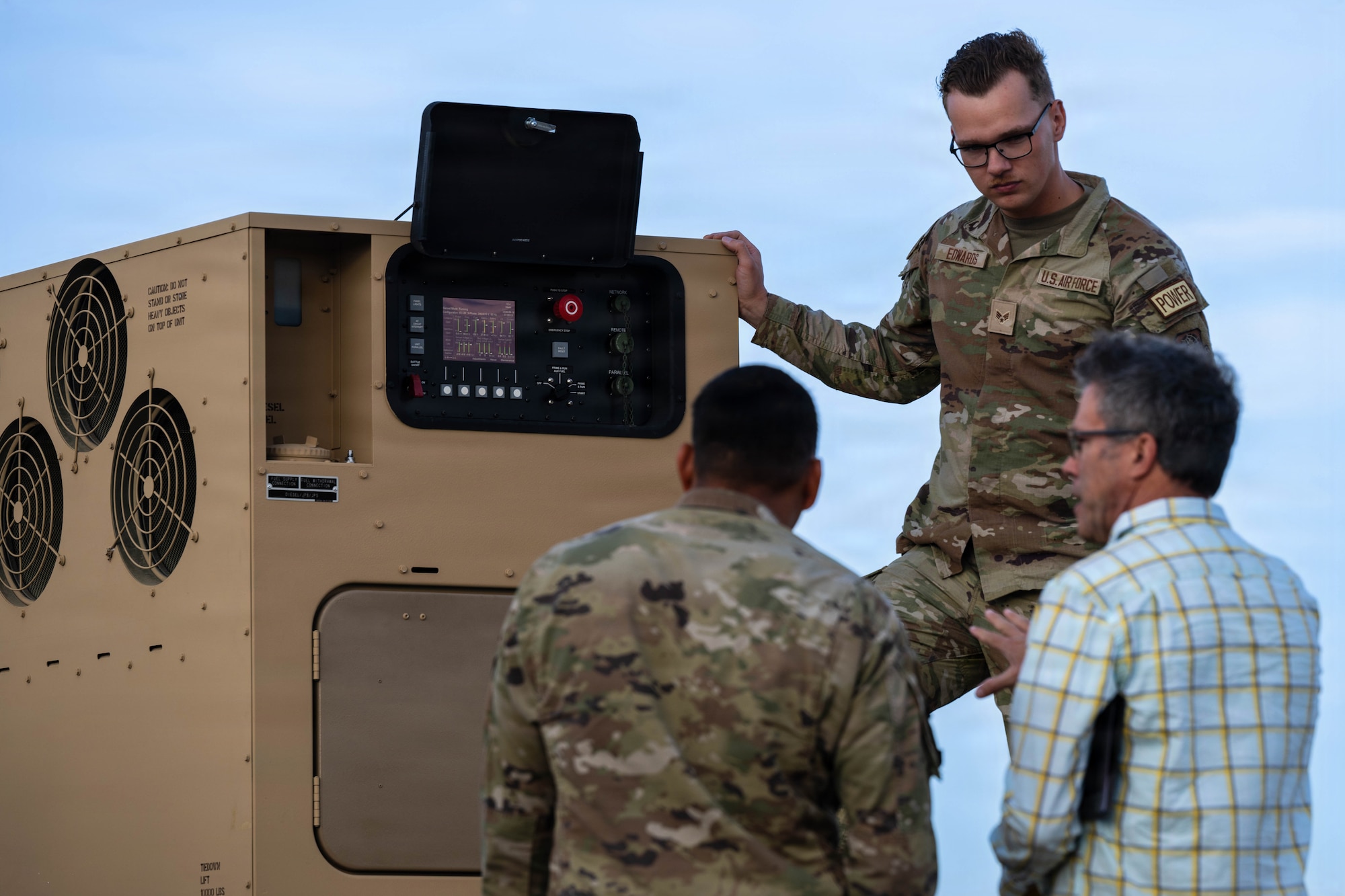 U.S Air Force Senior Airman Triton Edwards, 22nd Civil Engineer Squadron electrical power production specialist, demonstrates how quiet a generator can run during Summer Industry Preview at McConnell Air Force Base, Kansas, Aug. 19, 2026. Participants got a firsthand look at how commercial technology and defense solutions align to support the 22nd Air Refueling Wing. (U.S. Air Force photo by Senior Airman Patrick O’Neill)