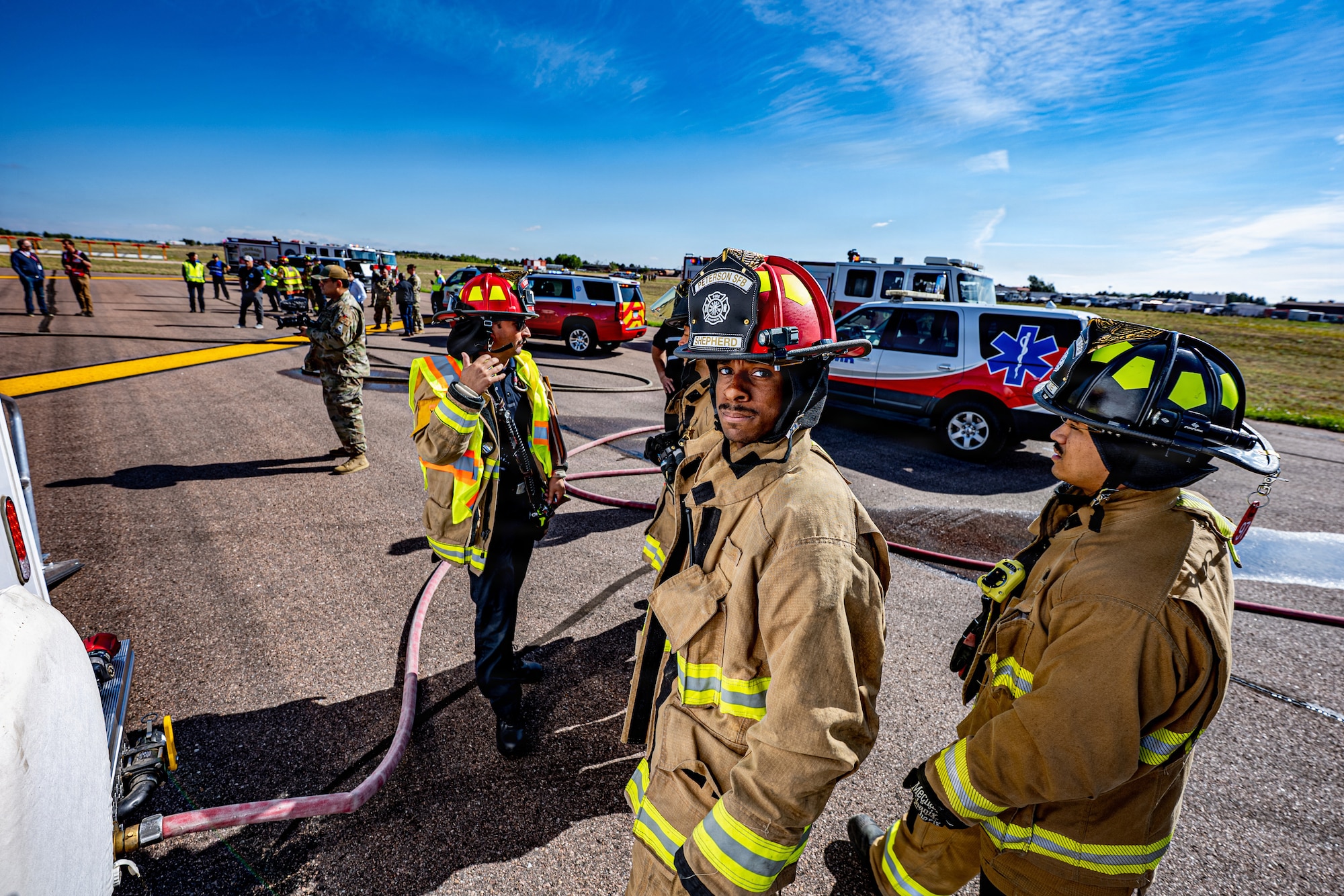 Firefighters assigned to the 21st Civil Engineer Squadron coordinate emergency response operations