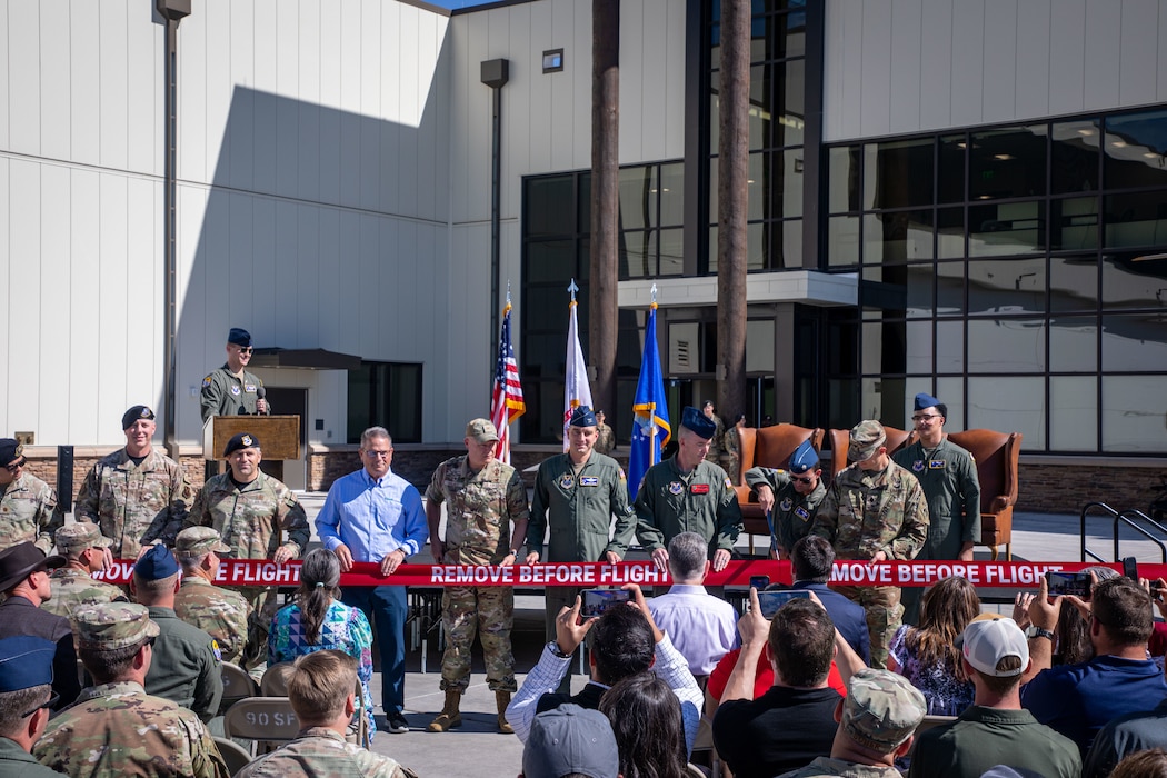 Lt. Col. Elijah McMahn, U.S. Army Corps of Engineers, Omaha District deputy commander – West, stands with Air Force leadership while cutting the ribbon for the new 37th Helicopter Squadron and 90th Missile Security Operations Squadron Tactical Response Force building at F.E. Warren Air Force Base, Wyoming, Aug. 14, 2026.