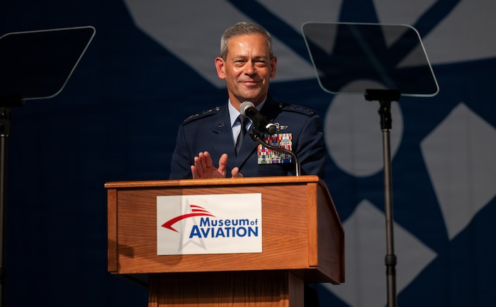 Air Force Chief of Staff Gen. Ken Wilsbach claps hands at podium