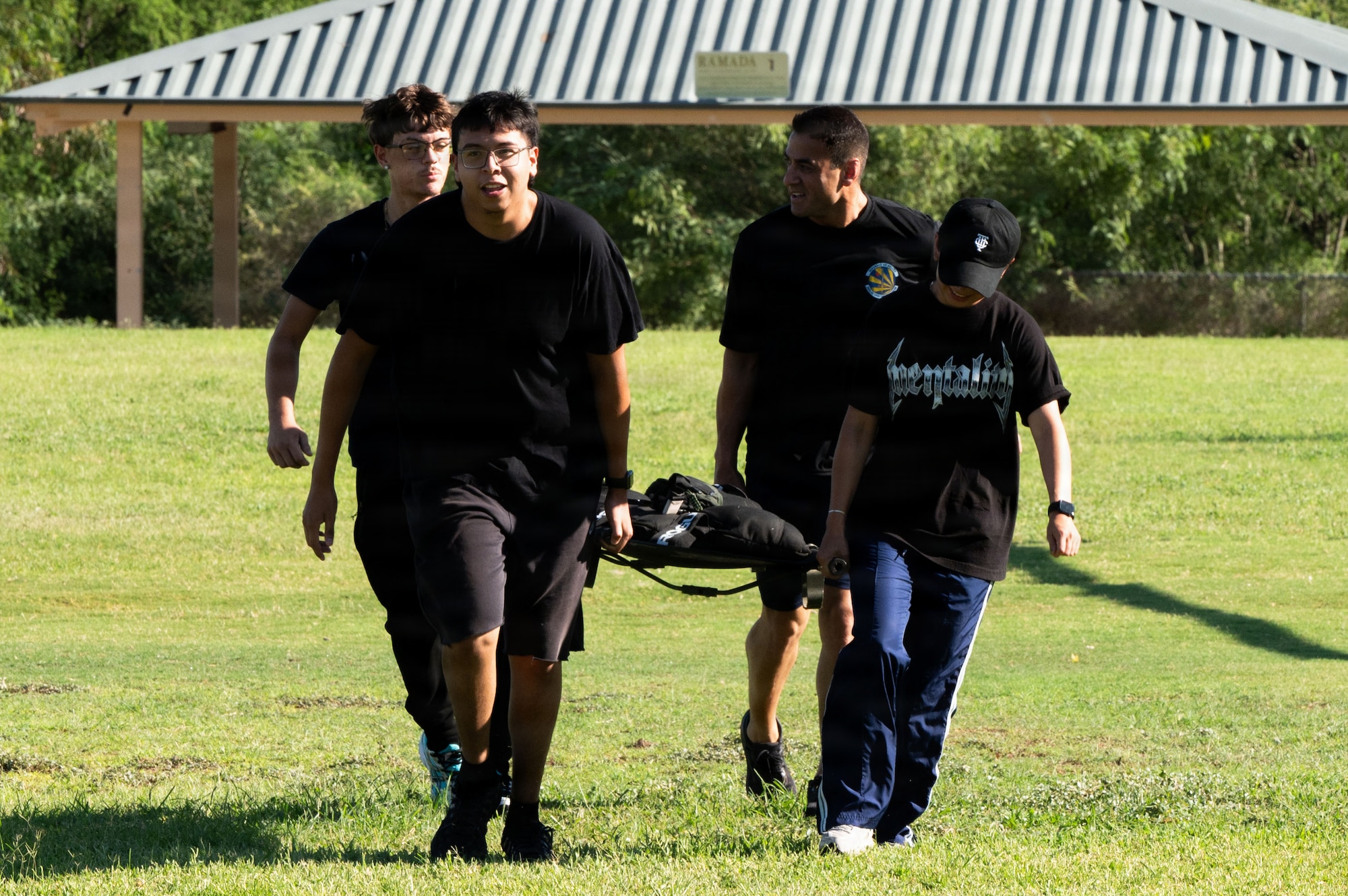 U.S. Air Force Lt. Col. Ricardo Flores, 362nd Recruiting Squadron commander, participates in a Special Warfare training day with Air Force Delayed Entry Program recruits Aug. 20, 2026 at Silverlake Park in Tucson, Arizona. The recruits, as well as leadership from the 362 RCS and 68th Rescue Squadron were tasked with carrying 200lb sandbags in groups of four to highlight the importance of  physical readiness and commitment to fostering the next generation of Airmen. (U.S. Air Force photo by Airman Najzee Kuzu)