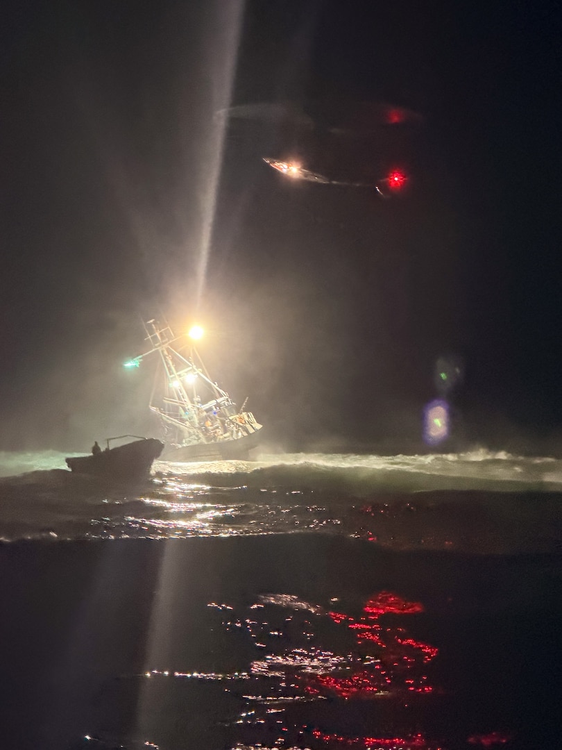 A Coast Guard Air Station San Francisco MH-65 Dolphin helicopter crew hovers over the motor vessel Lake Bay, a 58-foot fishing vessel, during a search and rescue case near Point Reyes, California, Aug. 21, 2026. Coast Guard crews responded to a distress call after Lake Bay’s crew ran aground and entered a surf zone near Ten Mile Beach off Point Reyes. (U.S. Coast Guard photo courtesy Station Bodega Bay)