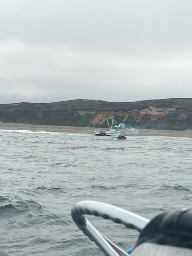 A Coast Guard Station Golden Gate 47-foot Motor Lifeboat crew monitors the motor vessel Lake Bay’s captain maneuvering a skiff away from the shoreline during a search and rescue case off Ten Mile Beach near Point Reyes, California, Aug. 21, 2026. Coast Guard crews from Station Bodega Bay, Station Golden Gate and Air Station San Francisco responded to a vessel aground and in the surf zone with five people aboard off Point Reyes. (U.S. Coast Guard photo courtesy Station Golden Gate)