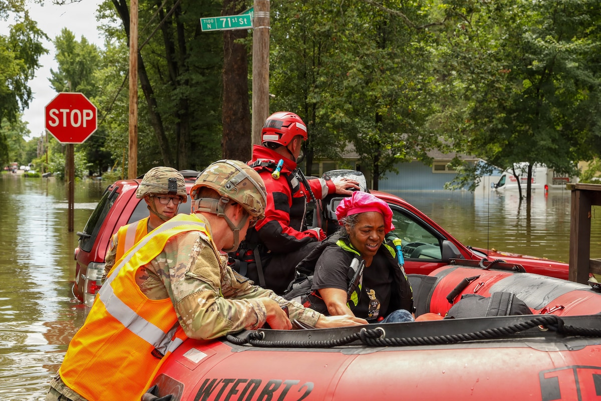 Indiana National Guardsmen with the 113th Engineer Battalion assist the Indianapolis Fire Department with flood evacuations Aug. 15, 2026, in response to devastating storms that swept through Indiana.