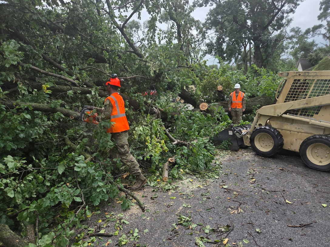 Indiana National Guardsmen with 113th Engineer Battalion clear arboreal debris in Gary, Indiana, in response to devastating storms that swept through the state Aug. 14, 2026.