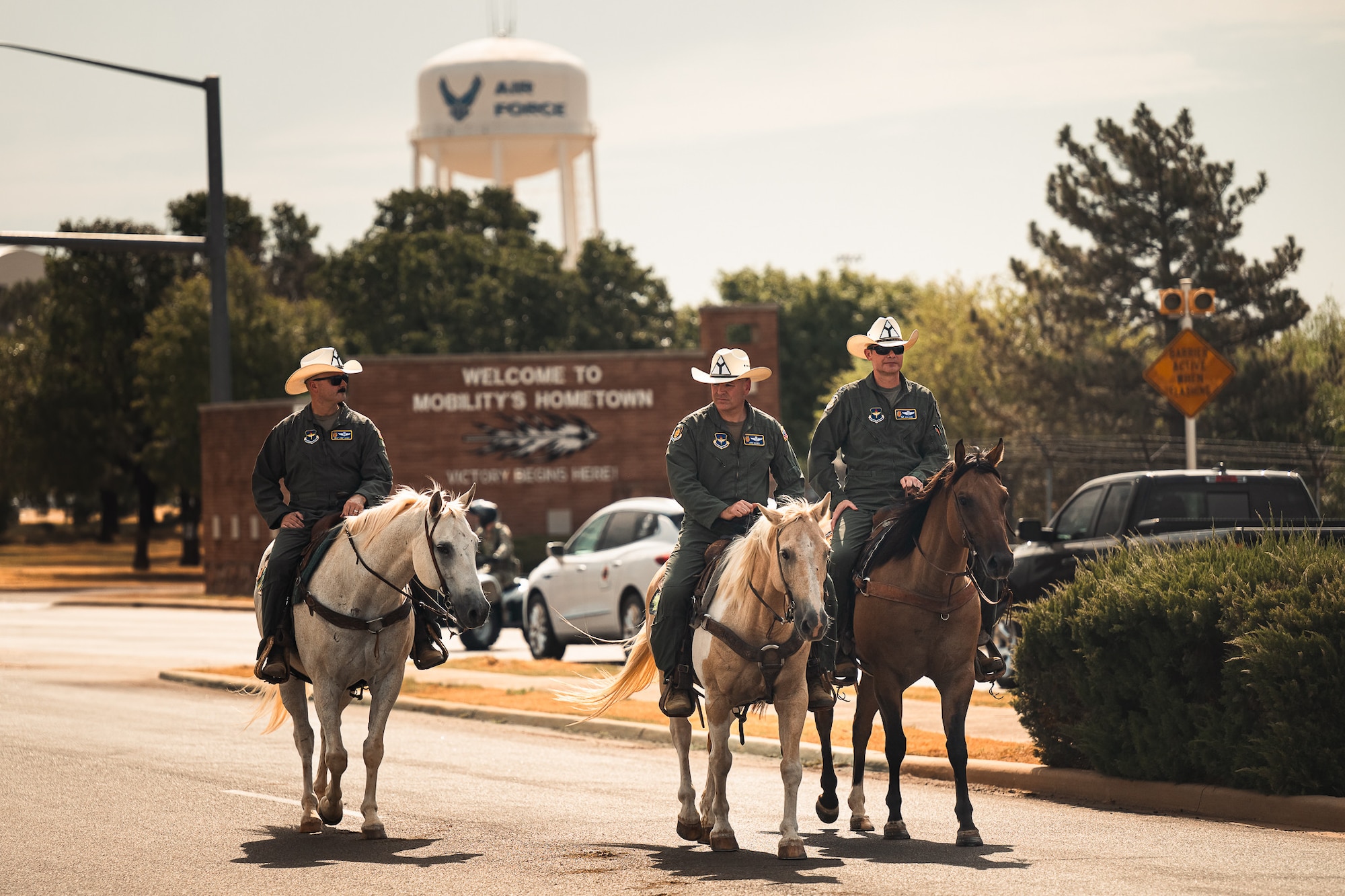 The 97th Air Mobility Wing command team rides in the 28th Annual Cattle Drive at Altus Air Force Base, Oklahoma, Aug. 20, 2026. Beyond celebrating the region's ranching heritage, the event highlights the enduring partnership between the base and the surrounding southwest Oklahoma community. (U.S. Air Force photo by Senior Airman Jonah Bliss)