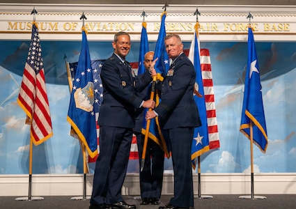 Air Force Chief of Staff Gen. Ken Wilsbach hands the guidon to Lt. Gen. Paul Fast