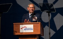 Air Force Chief of Staff Gen. Ken Wilsbach claps hands at podium