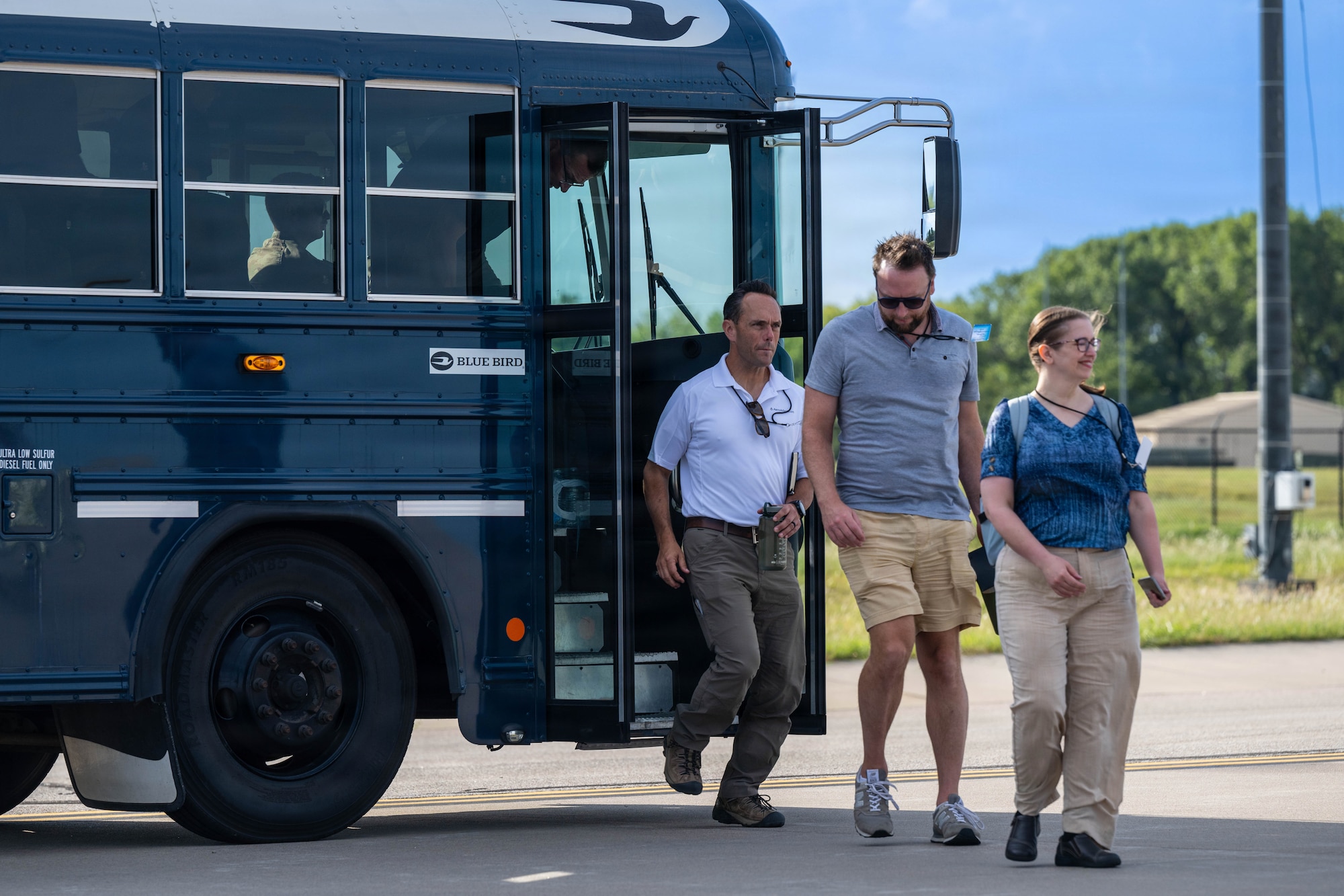 Summer Industry Preview participants step off of a bus at McConnell Air Force Base, Kansas, Aug. 19, 2026. During the event, industry leaders were able to get up close with the aircraft and crews that keep global reach ready 24/7. (U.S. Air Force photo by Senior Airman Patrick O’Neill)