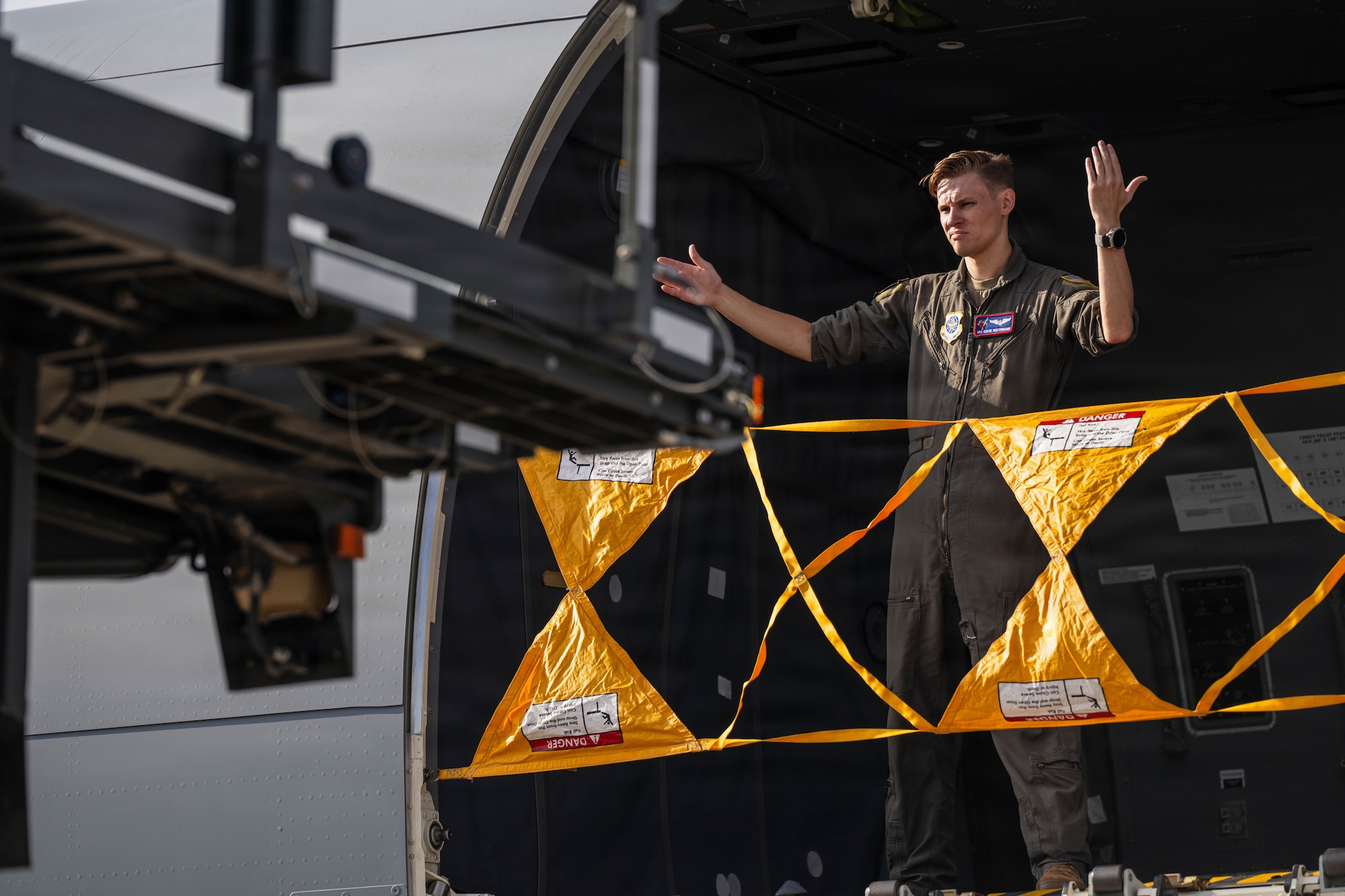 U.S. Air Force Senior Airman Caleb Heistermann, 344th Air Refueling Squadron boom operator, directs a 25K Loader toward a KC-46A Pegasus during Summer Industry Preview at McConnell Air Force Base, Kansas, Aug. 19, 2026. SIP allowed participants to explore the flight line at McConnell to see how defense innovations directly support mobility aircrew. (U.S. Air Force photo by Senior Airman Patrick O’Neill)