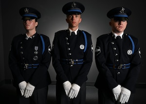 From left, U.S. Space Force Spc. 3 Amelia Olsen, Spc. 3 Dylan Lee, and Spc. 3 Logan Bergstrom, ceremonial guardsmen with the U. S. Space Force Honor Guard, model the new Honor Guard ceremonial uniforms at Joint Base Anacostia-Bolling, Washington, D.C., Aug. 21, 2026. The new uniform was designed to replace the modified U.S. Air Force service uniform Guardians wore when the branch was first established in 2019. (U.S. Air Force photo by Senior Airman Shanel Toussaint)