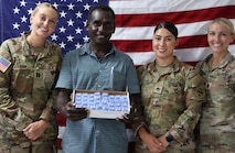 Tripler Army Medical Center and Oceania Engagement Team personnel present Obiga Newton, Solomon Islands ENT Clinic Nurse and Audiometrist, with a donation of hearing protection. (Photo by Staff Sgt. Susana Castillo)