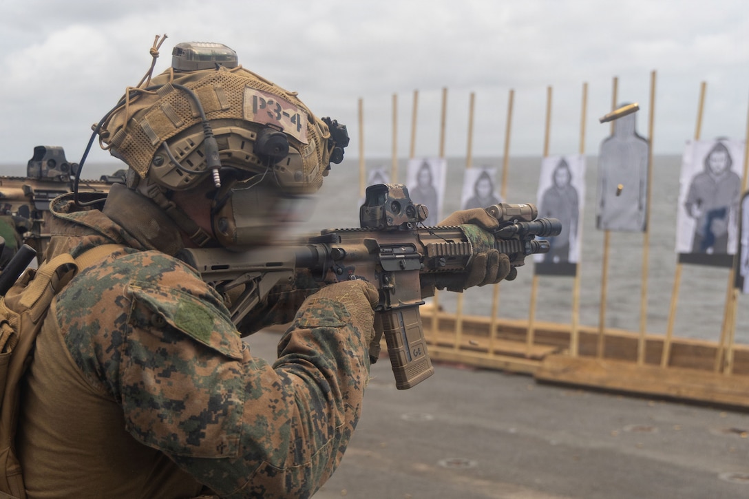 A U.S. Marine with Maritime Raid Force, Littoral Combat Force-24, engages targets during a sustainment range on the flight deck of San Antonio-class amphibious transport dock USS San Antonio (LPD 17), while underway in the Pacific Ocean, Aug. 14, 2026. U.S. military forces are deployed to the U.S. Southern Command area of responsibility in support of Joint Task Force Western Hemisphere, Department of War-directed operations, and the President's priorities to disrupt illicit drug trafficking, deter malign actors and protect the homeland through continuous presence. (U.S. Marine Corps photo)