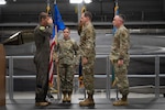 U.S. Air Force Chief Master Sgt. Daniel Dickerson, the incoming command chief of the 158th Fighter Wing, salutes Col. Michael Blair, the commander of the 158th Fighter Wing, during a change of responsibility ceremony