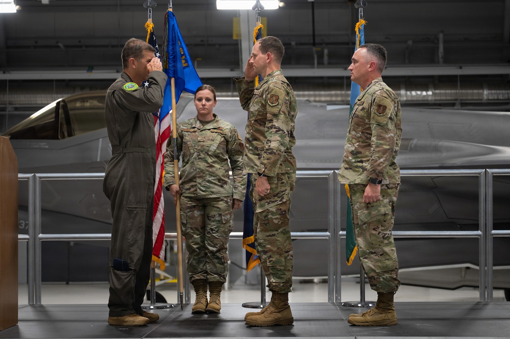U.S. Air Force Chief Master Sgt. Daniel Dickerson, the incoming command chief of the 158th Fighter Wing, salutes Col. Michael Blair, the commander of the 158th Fighter Wing, during a change of responsibility ceremony