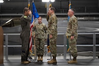 U.S. Air Force Chief Master Sgt. Daniel Dickerson, the incoming command chief of the 158th Fighter Wing, salutes Col. Michael Blair, the commander of the 158th Fighter Wing, during a change of responsibility ceremony