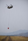 A CH-47 Chinook Helicopter hoovers near the Army Aviation Support Facility 2 at Pangborn Memorial Airport, East Wenatchee, Wash., August 16, 2026.