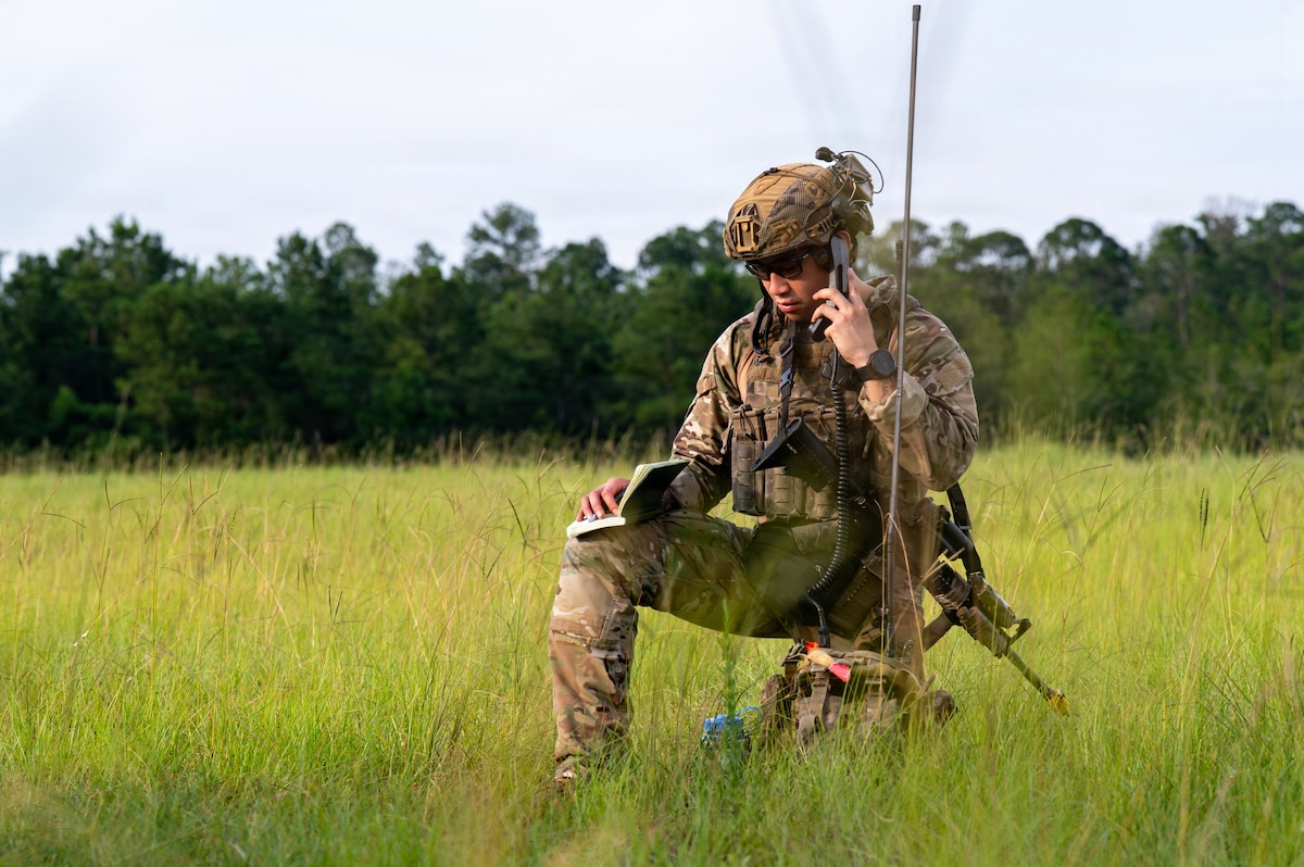 Airman talking on radio.