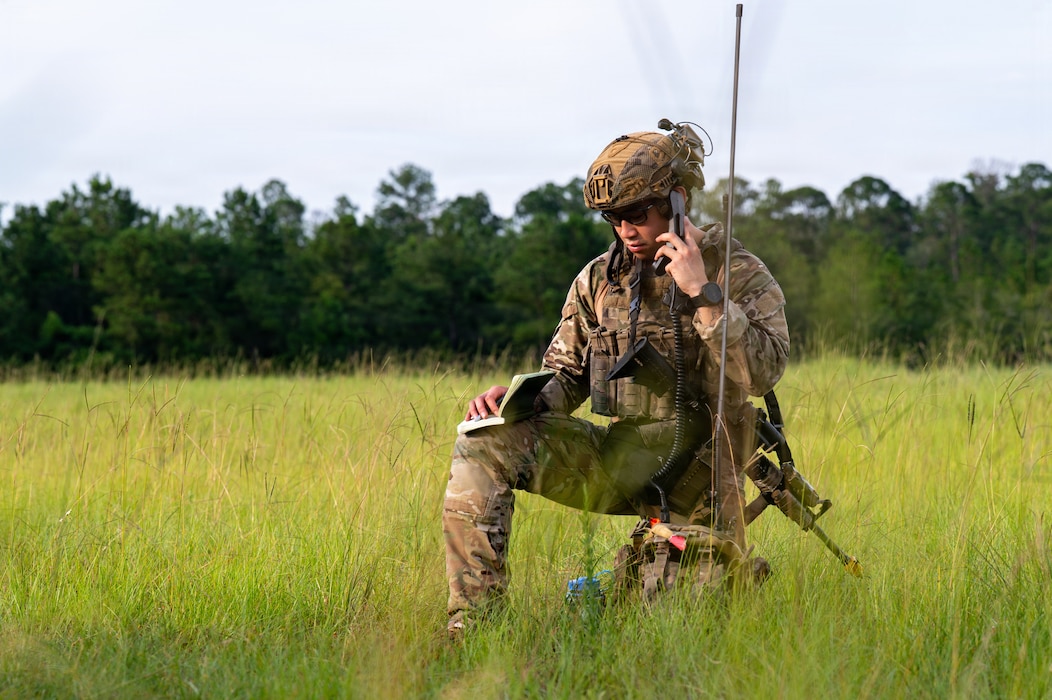Airman talking on radio.