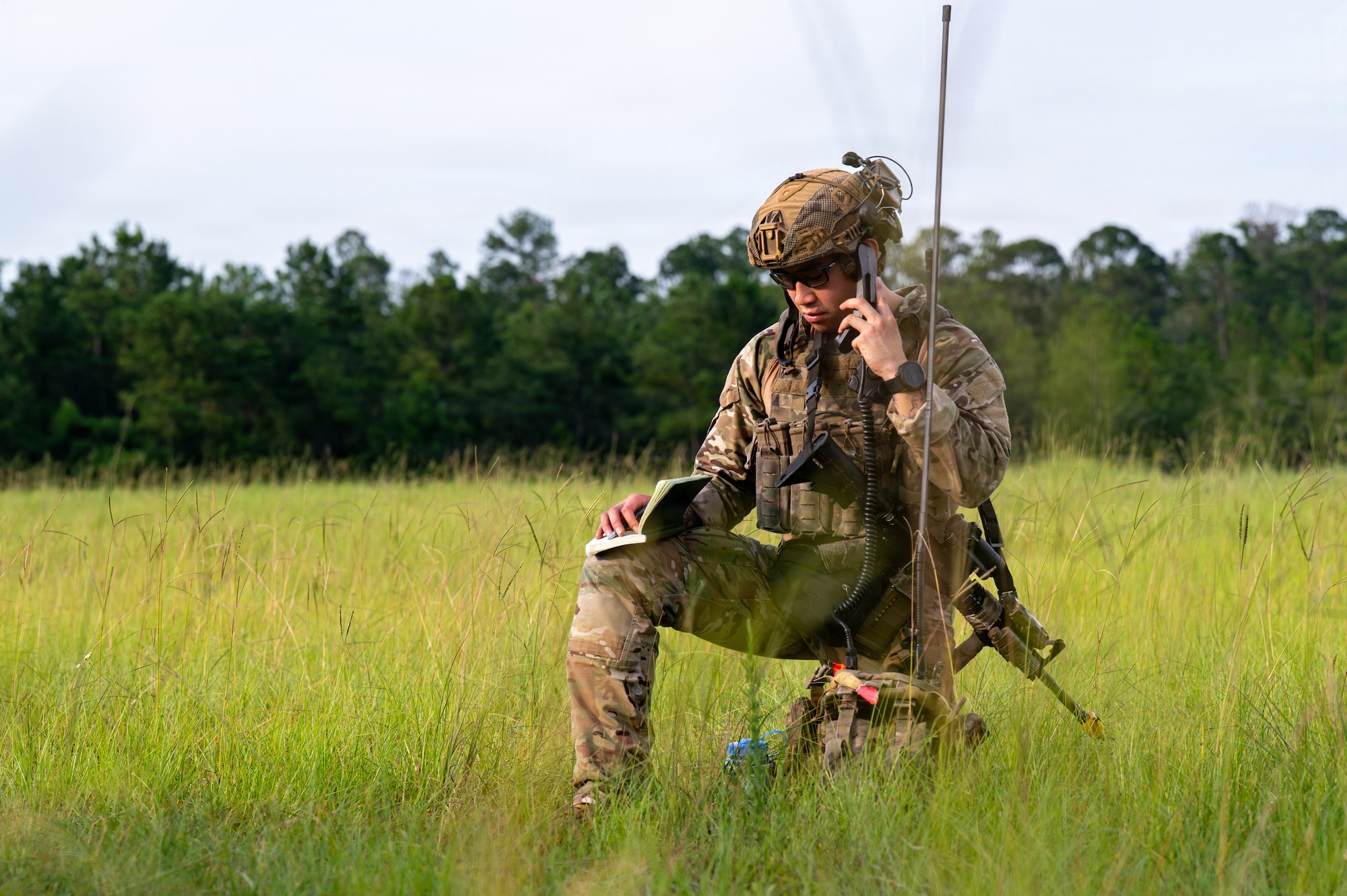 Airman talking on radio.