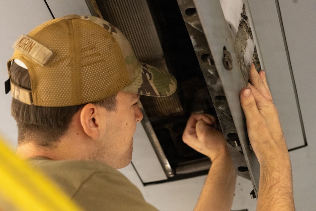 Airman working on plane