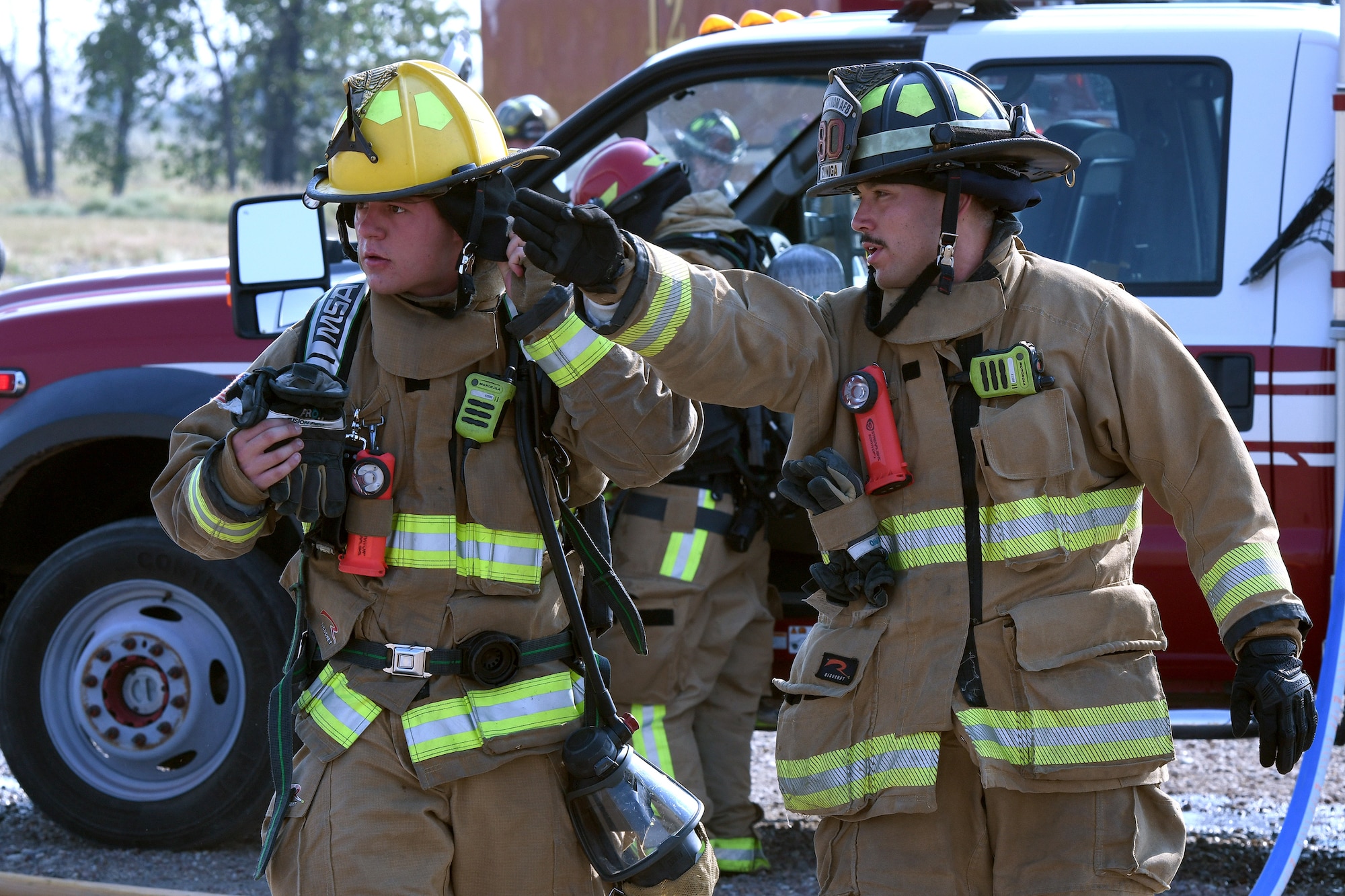 Malmstrom AFB firefighters with the 341st Civil Engineer Squadron give out orders during a Mass Accident Response Exercise at Malmstrom AFB.