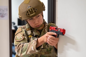 An Airman checks corners during an active shooter training