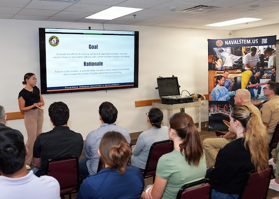 JOINT BASE SAN ANTONIO-FORT SAM HOUSTON (Aug. 11, 2026) Arleen Hidalgo Morales, of Moca, Puerto Rico, an intern assigned to Naval Medical Research Unit (NAMRU) San Antonio, presented research on the evaluation sterilization efficacy of a portable sterilization unit at reduced cycle times at the Battlefield Health and Trauma Research Institute. Hidalgo Morales, a U.S. Army first lieutenant in the Puerto Rico National Guard, earned her master’s in Bioengineering from University of Puerto Rico Mayaguez Campus. She is participating in the Office of Naval Research’s Naval Research Enterprise Internship Program (NREIP). NREIP gives academically talented college students, graduating seniors, and graduate students pursuing STEM careers the opportunity to learn about Naval research and technology while receiving first-class mentoring by top scientists and engineers. NAMRU San Antonio, part of Navy Medicine Research & Development, conducts gap-driven combat casualty care, craniofacial, and directed energy research in support of Navy, Marine Corps and joint U.S. warfighter health readiness and lethality while engaged in routine and expeditionary operations. Navy Medicine’s 44,000+ talented and ready forces optimize health readiness, deliver quality healthcare, and provide global expeditionary medical support to warfighters. (U.S. Navy Photo by Burrell Parmer/Released)