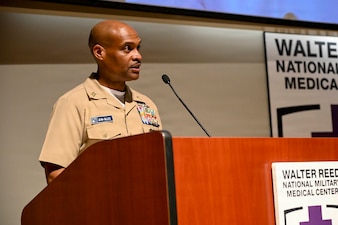 Master Chief Hospital Corpsman Philip Jean-Gilles speaks as the guest speaker at Chief Hospital Corpsman Avesta El’s retirement ceremony at Walter Reed National Military Medical Center, August 14, 2026. Navy Medicine Readiness and Training Command (NMRTC) Bethesda mission is to maximize warfighter performance through optimized medical readiness tailored to operational requirements; enhance the readiness of the medical force to sustain expeditionary medical capability; and train and develop the Navy Medicine Force. (U.S. Navy photo Mass Communication Specialist Second Class Alec Kramer)