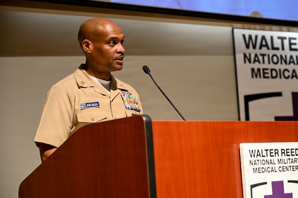 Master Chief Hospital Corpsman Philip Jean-Gilles speaks as the guest speaker at Chief Hospital Corpsman Avesta El’s retirement ceremony at Walter Reed National Military Medical Center, August 14, 2026. Navy Medicine Readiness and Training Command (NMRTC) Bethesda mission is to maximize warfighter performance through optimized medical readiness tailored to operational requirements; enhance the readiness of the medical force to sustain expeditionary medical capability; and train and develop the Navy Medicine Force. (U.S. Navy photo Mass Communication Specialist Second Class Alec Kramer)