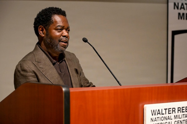 Master Chief Hospital Corpsman (Retired) Carnell L. Boyd speaks as a guest speaker at Chief Hospital Corpsman Avesta El’s retirement ceremony at Walter Reed National Military Medical Center, August 14, 2026. Navy Medicine Readiness and Training Command (NMRTC) Bethesda mission is to maximize warfighter performance through optimized medical readiness tailored to operational requirements; enhance the readiness of the medical force to sustain expeditionary medical capability; and train and develop the Navy Medicine Force. (U.S. Navy photo Mass Communication Specialist Second Class Alec Kramer)