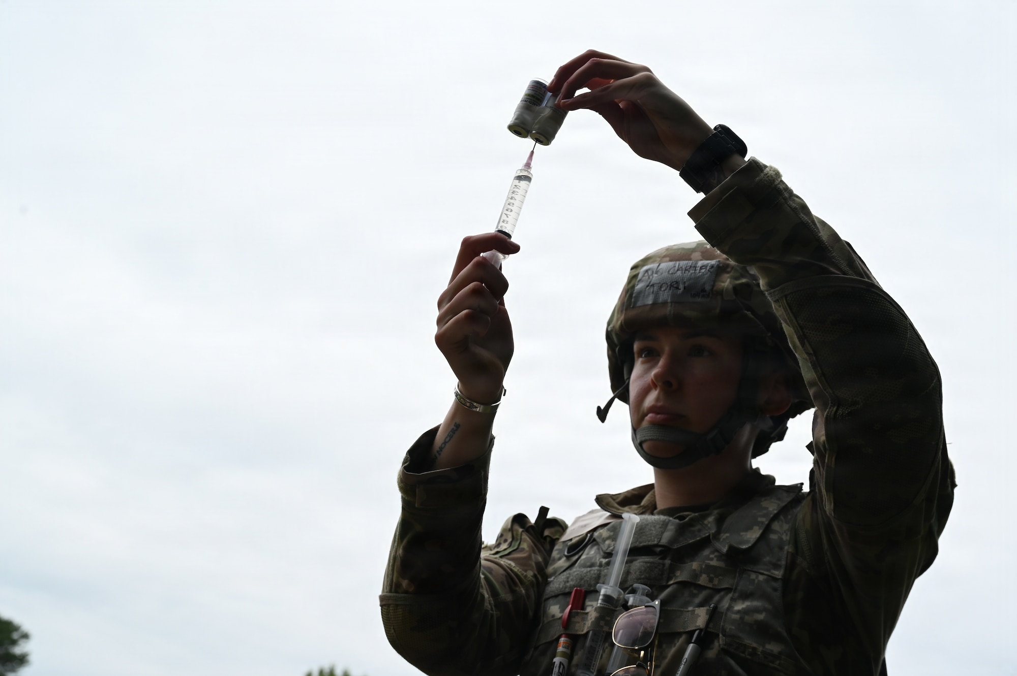 U.S. Air Force Airman 1st Class Victoria Carter, an aerospace medical technician at the 104th Fighter Wing, prepares a dosage of medication at Barnes Air National Guard Base, Westfield, Mass., August 22, 2026. Tier 3 Tactical Combat Casualty Care Airmen learned about pain medications, antibiotic administration, and medication calculations. (U.S. Air National Guard photo by Airman 1st Class Ellen Ozkaptan)