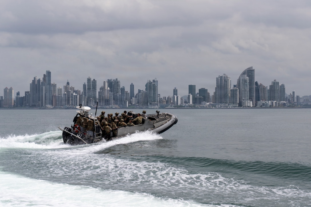 A U.S. Coast Guard Maritime Security Response Team (MSRT) West boat transits toward its return location following a simulated non-compliant boarding exercise as part of PANAMAX 2026, with Panama City in the background, Aug. 5, 2026.