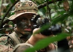 U.S. Army Spc. Benjamin Peace, an infantryman with 1st Squadron, 180th Cavalry Regiment, pulls security during jungle tactics training at Exercise Pahlawan Warrior 2026 in Liang Training Area Brunei Darussalam, Aug. 16, 2026. Exercise Pahlawan Warrior is a biennial bilateral exercise between the U.S. Army Pacific and the RBLF, designed to enhance readiness, interoperability, and strengthen bilateral defence cooperation. (Oklahoma National Guard photo by Sgt. Anthony Ackah-Mensah)
