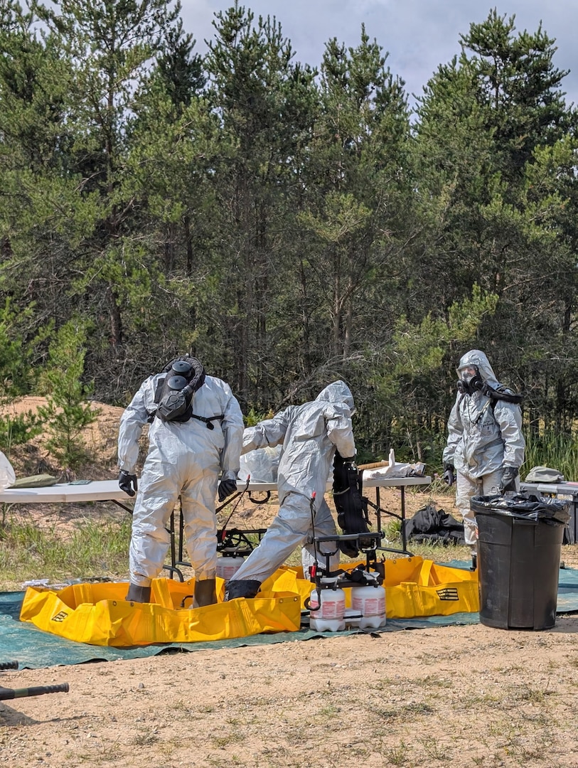Soldiers from the Montana Army National Guard's 631st Chemical Company practice dismounted decontamination procedures during the Northern Strike 26-2 exercise at Camp Grayling, Michigan, in August 2026.