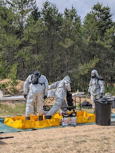 Soldiers from the Montana Army National Guard's 631st Chemical Company practice dismounted decontamination procedures during the Northern Strike 26-2 exercise at Camp Grayling, Michigan, in August 2026.