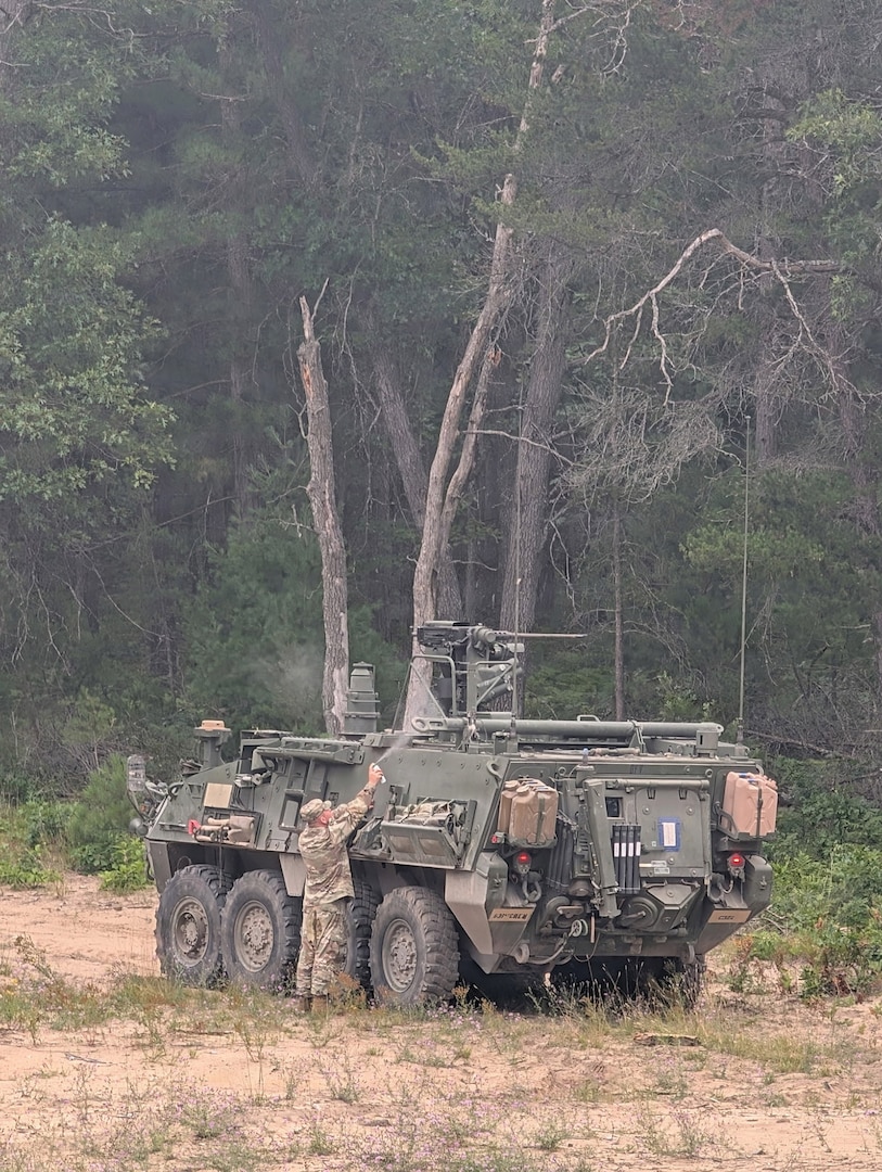 A Montana Army National Guard soldier assigned to the 631st Chemical Company inspects a Stryker vehicle during the Northern Strike 26-2 exercise at Camp Grayling, Michigan, in August 2026.