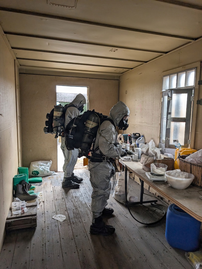 Soldiers from the Montana Army National Guard’s 631st Chemical Company analyze a simulated chemical agent inside a training facility during Northern Strike 26-2 at Camp Grayling, Michigan, in August 2026.